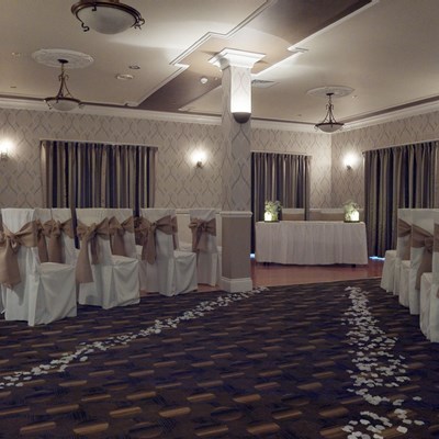 The room set up for a civil ceremony with curtains closed