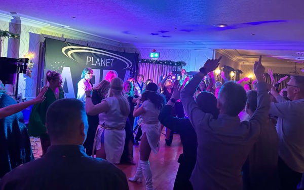 A full dancefloor at The Manor Leeds while Planet ABBA perform.