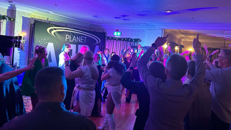 A full dancefloor at The Manor Leeds while Planet ABBA perform.