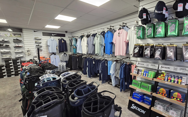A view of the products on display in The Manor's golf shop; bags, shirts, footwear, hats, gloves and golf balls can be seen.