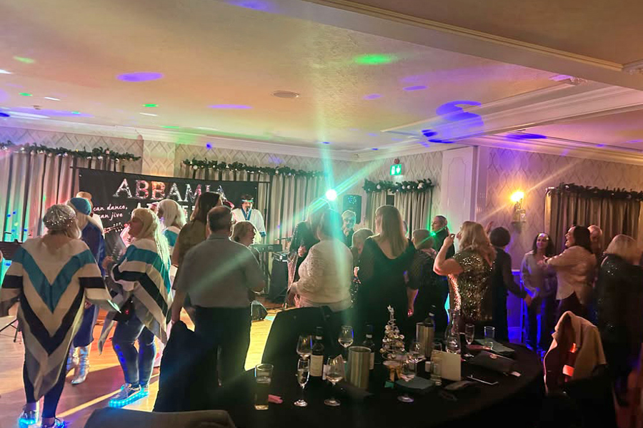 A full dancefloor at The Manor Leeds while ABBAMIA perform.