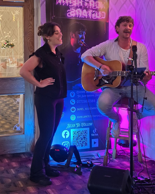 The Manor Assistant Events Manager Starr performing a duet with singer Dan Kelly.