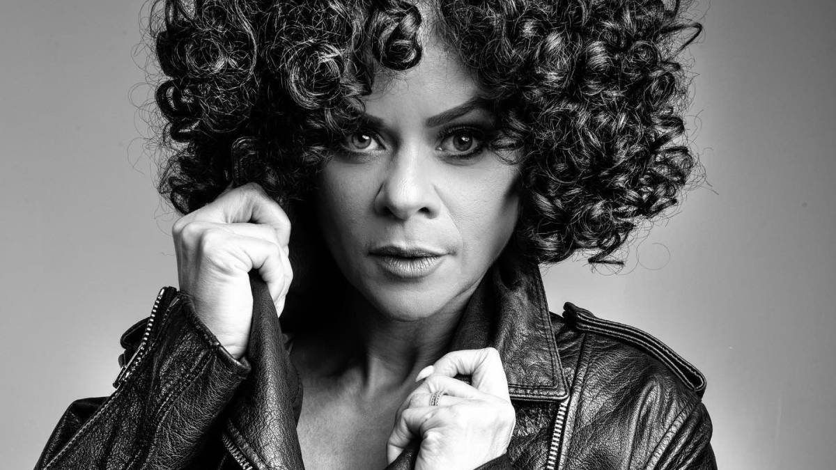 A black and white photo of Whitney Houston tribute Marcia Lynette in a leather jacket.