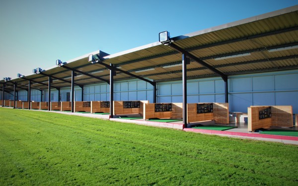 A view into the covered bays of the Driving Range at The Manor Leeds.